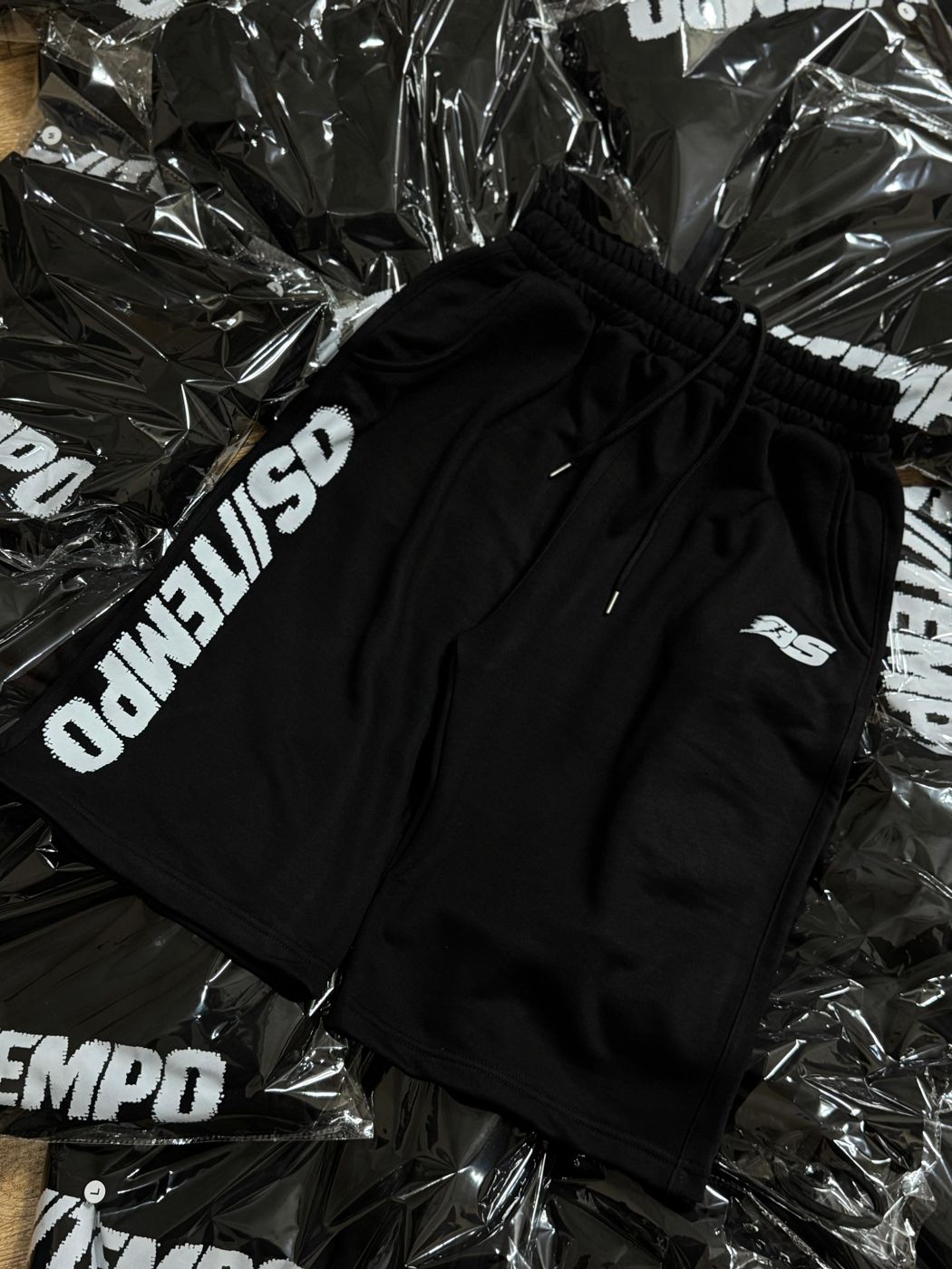 OS//TEMPO shorts laid on packaged inventory